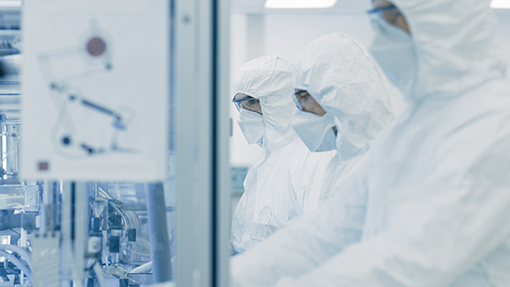 01 - Team of Scientists in Sterile Protective Clothing Work